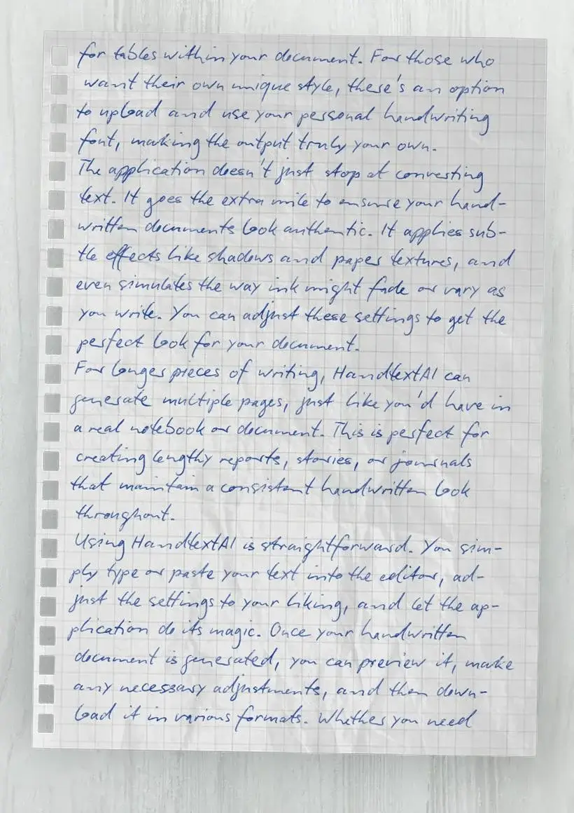 Handwritten text on light gray graph paper on pale ash table